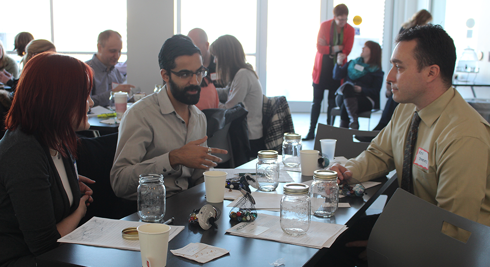 People engaged in discussion groups at a workshop