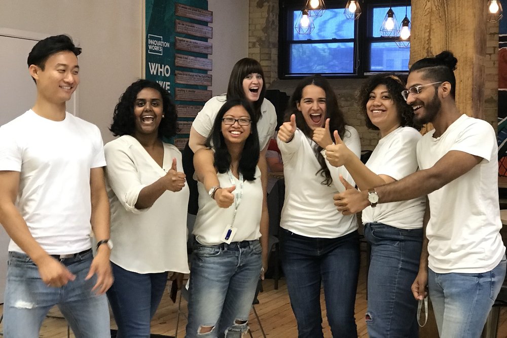 Group of Youth Volunteers smiling and giving thumbs up